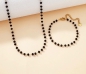 Preview: Kette Edelstahl gold mit schwarzen Kristallen